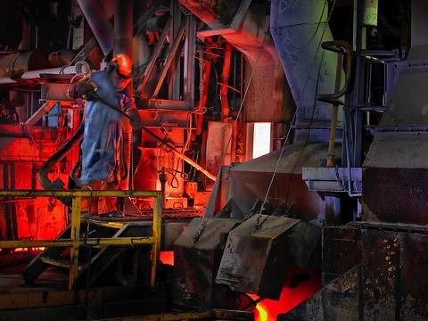 Smelter worker working furnace